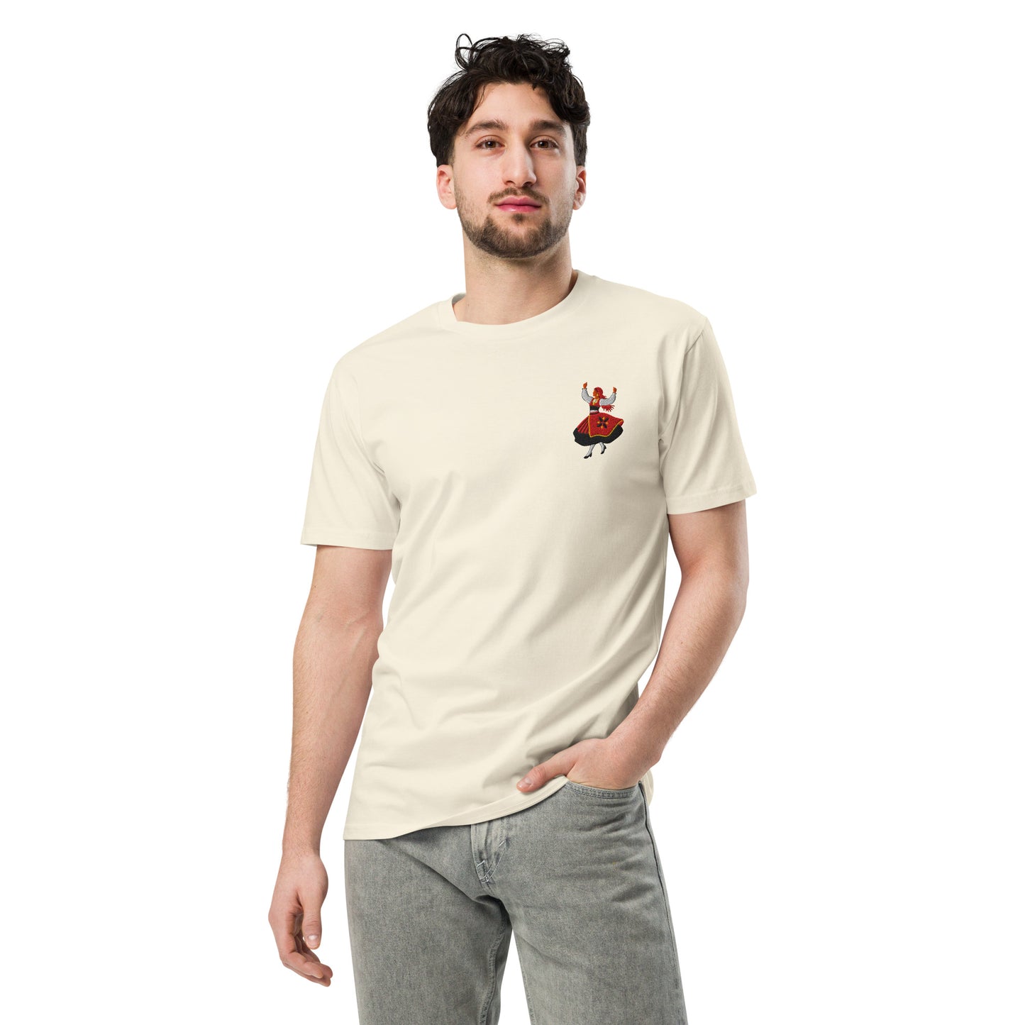 Close up of the rancho folclórico embroidery on a natural RAIZ tee